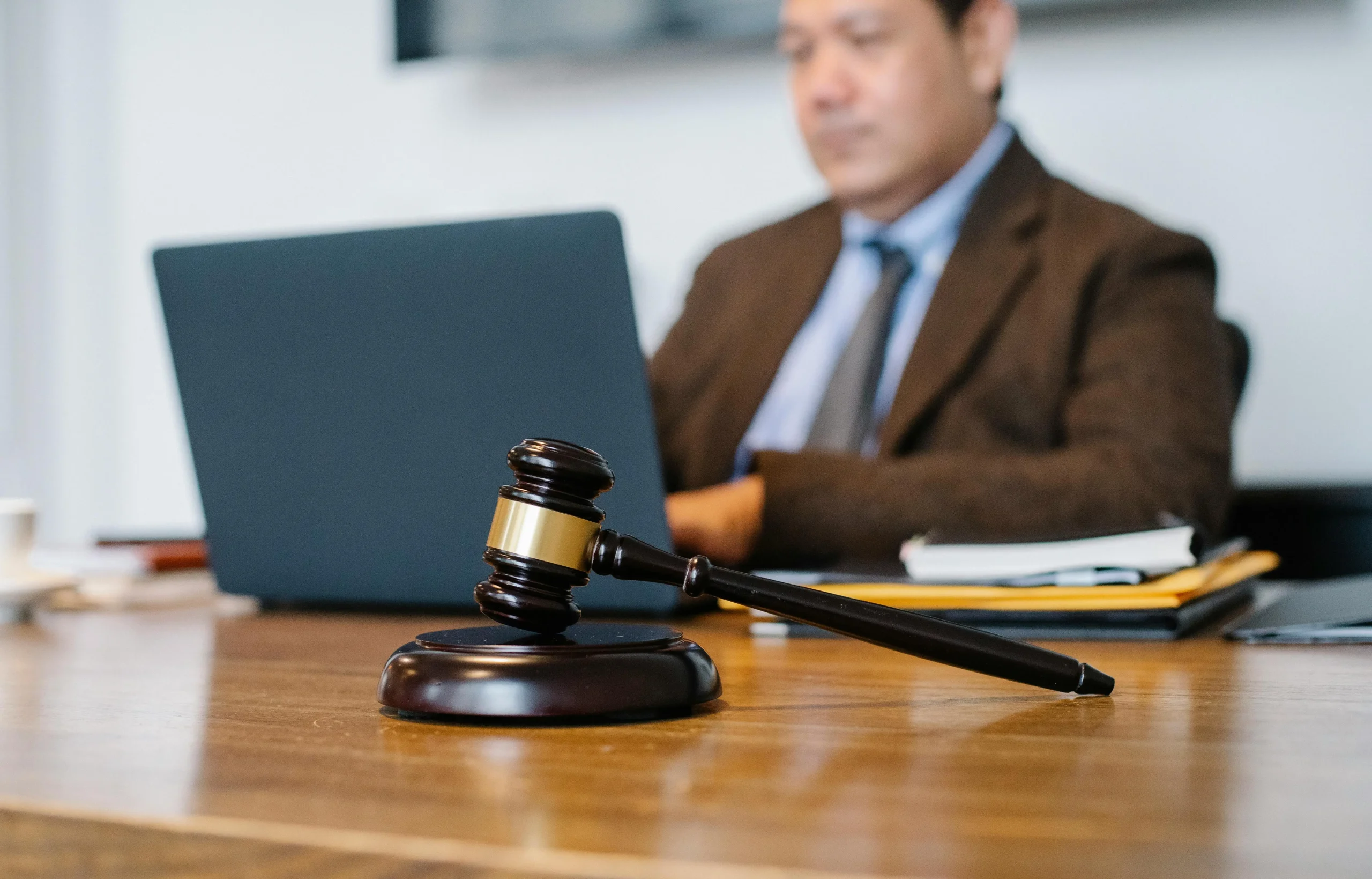 a gavel on a table, Educational Pathway to Becoming an Attorney